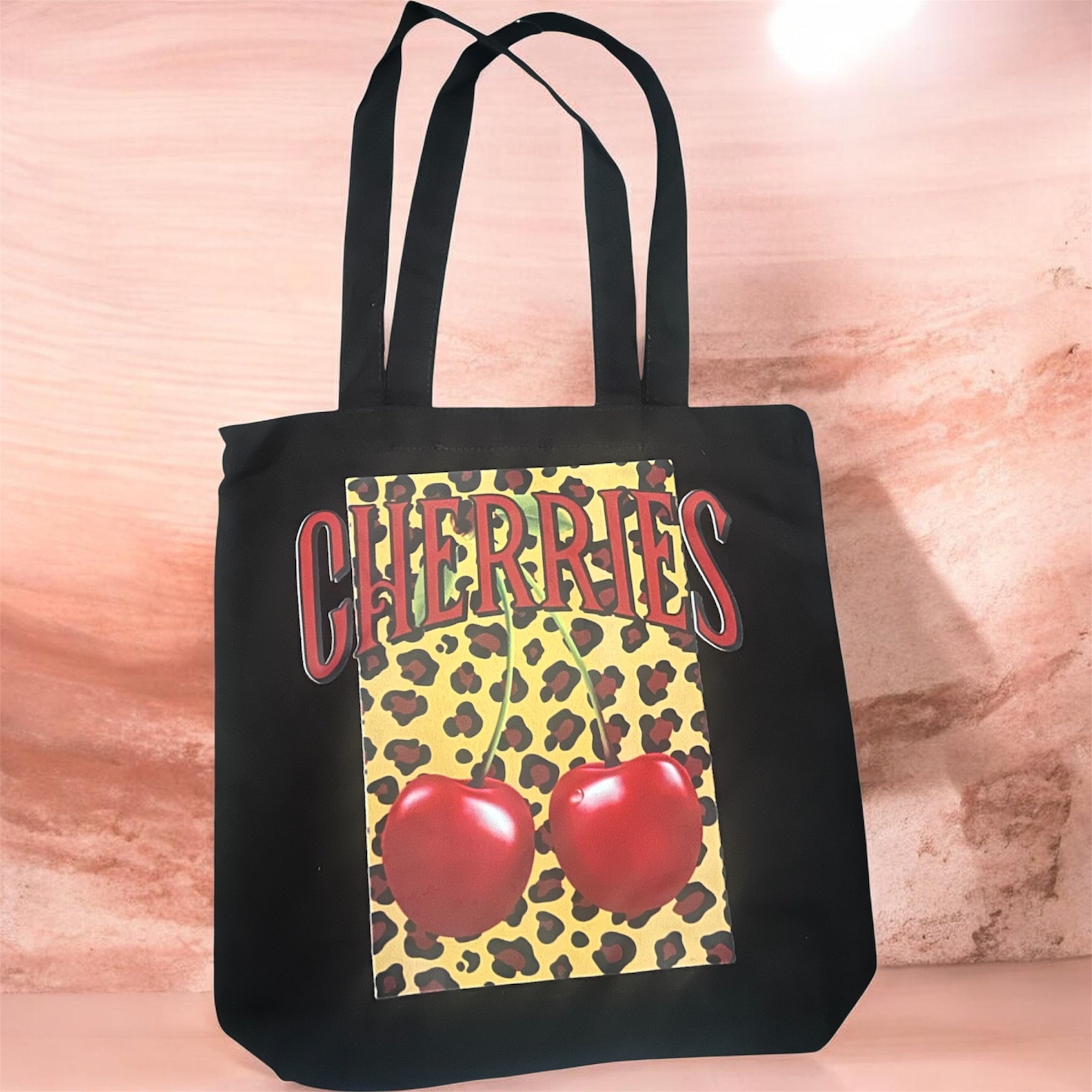 Medium-sized bag with a cherry design—perfect for carrying personal items and more